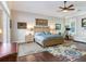 Spacious Primary bedroom with wood flooring and large bed at 1503 Limona Rd, Brandon, FL 33510