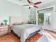 Bedroom with a king-size bed, access to a patio, and hardwood floors at 1503 Limona Rd, Brandon, FL 33510