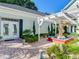 Elegant courtyard with fountain, pergola, and lush landscaping at 1503 Limona Rd, Brandon, FL 33510