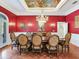 Formal dining room with hardwood floors, chandelier, and painted ceiling at 1503 Limona Rd, Brandon, FL 33510