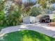 Landscaped yard with a long driveway and carport at 1503 Limona Rd, Brandon, FL 33510