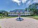 Beautiful home with a large front porch, fountain, and landscaped yard at 1503 Limona Rd, Brandon, FL 33510
