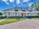 House with a long driveway, and manicured landscaping at 1503 Limona Rd, Brandon, FL 33510