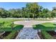 Landscaped front yard with circular fountain at 1503 Limona Rd, Brandon, FL 33510