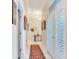 Bright hallway with marble floors, a runner, and French doors at 1503 Limona Rd, Brandon, FL 33510
