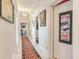 Elegant hallway with marble floors, a runner, and framed artwork at 1503 Limona Rd, Brandon, FL 33510