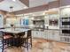 Spacious kitchen with island, stainless steel appliances, and tile floors at 1503 Limona Rd, Brandon, FL 33510