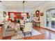 Living room with hardwood floors, fireplace, and French doors at 1503 Limona Rd, Brandon, FL 33510