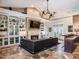 Spacious living room features a large sectional sofa, built-in shelving, and a fireplace at 1503 Limona Rd, Brandon, FL 33510