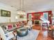 Bright living room featuring hardwood floors, fireplace and comfortable seating at 1503 Limona Rd, Brandon, FL 33510
