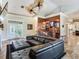 L Shaped sectional sofa anchors this living room with high ceilings and wet bar at 1503 Limona Rd, Brandon, FL 33510