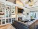 Living room with sectional sofa, fireplace, and built-in shelving at 1503 Limona Rd, Brandon, FL 33510