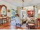Living room with hardwood floors, access to backyard, and views to dining room at 1503 Limona Rd, Brandon, FL 33510