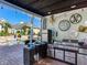 Outdoor kitchen with grill, sink, and mini-refrigerator at 1503 Limona Rd, Brandon, FL 33510