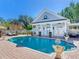Large kidney shaped pool with a pool house and patio at 1503 Limona Rd, Brandon, FL 33510