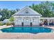Relaxing kidney-shaped pool and a beautiful pool house at 1503 Limona Rd, Brandon, FL 33510