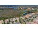 Beautiful aerial shot of a lakeside community, with lush landscaping and well-maintained homes at 16127 Cape Coral Dr, Wimauma, FL 33598