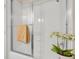 Clean bathroom with white tiled shower and clear glass door at 16127 Cape Coral Dr, Wimauma, FL 33598