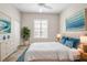 Bright bedroom featuring large windows, comfortable bed, and stylish furnishings at 16127 Cape Coral Dr, Wimauma, FL 33598