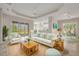 Bright and airy living room featuring stylish furnishings, neutral tones, and sliding glass doors to outdoor patio at 16127 Cape Coral Dr, Wimauma, FL 33598