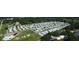 Aerial view of a large mobile home community with a pool and surrounding green space at 1710 7Th Sw St # 83, Ruskin, FL 33570