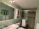 Clean bathroom with a vanity, medicine cabinet, and tiled shower at 1710 7Th Sw St # 83, Ruskin, FL 33570