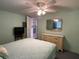 Cozy bedroom with light walls, ceiling fan, and built-in dresser at 1710 7Th Sw St # 83, Ruskin, FL 33570
