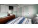 Well-lit bedroom with a ceiling fan and ample closet space at 1710 7Th Sw St # 83, Ruskin, FL 33570