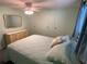 Serene bedroom with light walls, ceiling fan, and ample closet space at 1710 7Th Sw St # 83, Ruskin, FL 33570