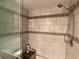 Clean shower with tiled walls and a handheld shower head at 1710 7Th Sw St # 83, Ruskin, FL 33570