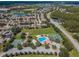 Aerial view of community with pool, tennis courts, and playground at 17443 Glenapp Dr, Land O Lakes, FL 34638