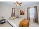 Cozy bedroom with double bed and large window at 17443 Glenapp Dr, Land O Lakes, FL 34638
