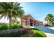 Community center entrance with palm trees and landscaping at 17443 Glenapp Dr, Land O Lakes, FL 34638