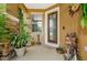 Welcoming front entry with stone accents and potted plants at 17443 Glenapp Dr, Land O Lakes, FL 34638