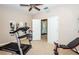 Bright home gym with treadmill and weight bench at 17443 Glenapp Dr, Land O Lakes, FL 34638