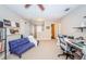 Loft area with a desk, sofa, and access to other rooms at 17443 Glenapp Dr, Land O Lakes, FL 34638