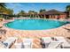 Resort-style pool with lounge chairs and nearby cabana at 17443 Glenapp Dr, Land O Lakes, FL 34638