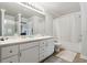 Bathroom with double vanity, bathtub, and shower at 18119 Sterling Gate Cir # 18119, Tampa, FL 33647