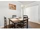 Dining area with four chairs and a table near built in shelving at 18119 Sterling Gate Cir # 18119, Tampa, FL 33647