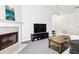 Living room fireplace with tile surround and media console at 18119 Sterling Gate Cir # 18119, Tampa, FL 33647