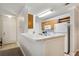 Kitchen with white appliances and breakfast bar at 18119 Sterling Gate Cir # 18119, Tampa, FL 33647