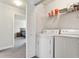 Laundry closet with washer, dryer, and shelving at 18119 Sterling Gate Cir # 18119, Tampa, FL 33647