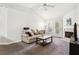 Living room featuring a fireplace, TV, and comfortable seating at 18119 Sterling Gate Cir # 18119, Tampa, FL 33647