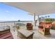 Spacious balcony with outdoor seating and ocean views at 19734 Gulf Blvd # 202, Indian Shores, FL 33785