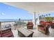 Relaxing balcony overlooking the beach, with patio furniture and ocean view at 19734 Gulf Blvd # 202, Indian Shores, FL 33785