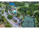 Aerial view showing community amenities including tennis courts and parking at 20922 Jaffa Ln, Land O Lakes, FL 34637