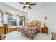 Spacious bedroom with a king-size bed and bay window, offering ample natural light at 20922 Jaffa Ln, Land O Lakes, FL 34637