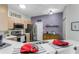 Modern kitchen with stainless steel appliances and breakfast bar at 20922 Jaffa Ln, Land O Lakes, FL 34637