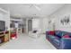 Open living room and kitchen area with neutral decor at 20922 Jaffa Ln, Land O Lakes, FL 34637