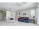 Bright living room featuring a comfy sofa and recliner, complemented by large windows at 20922 Jaffa Ln, Land O Lakes, FL 34637